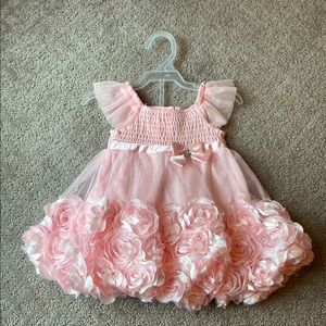 This is a @Nannette Dress. Color is light pink and it’s 6/9 months in size.